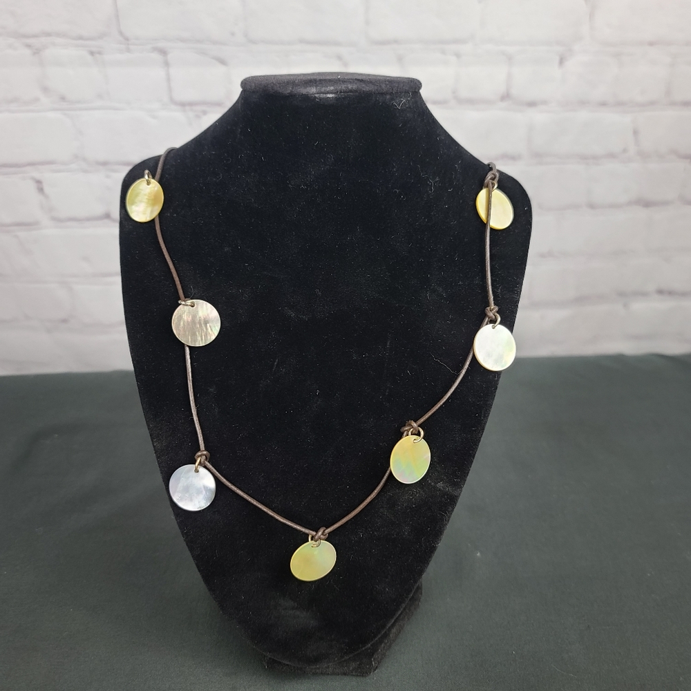 American Eagle Outfitters Necklace: leather and Mother of Pearl Disks.